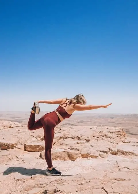 A woman stretching in the desert